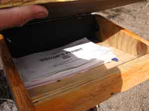 Backpacking permit box with permits in Sonora Pass.